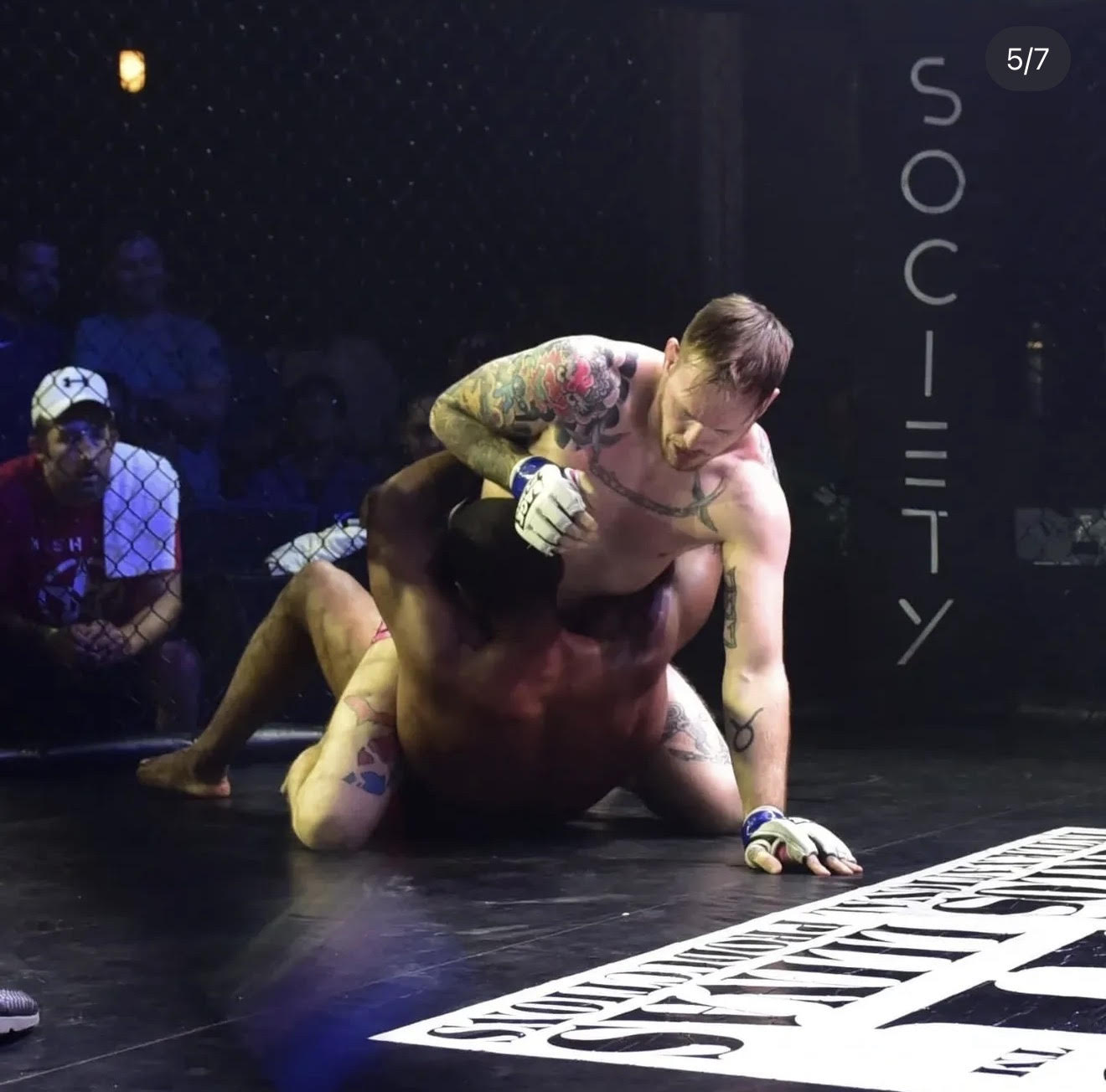 Intense grappling action during professional MMA match