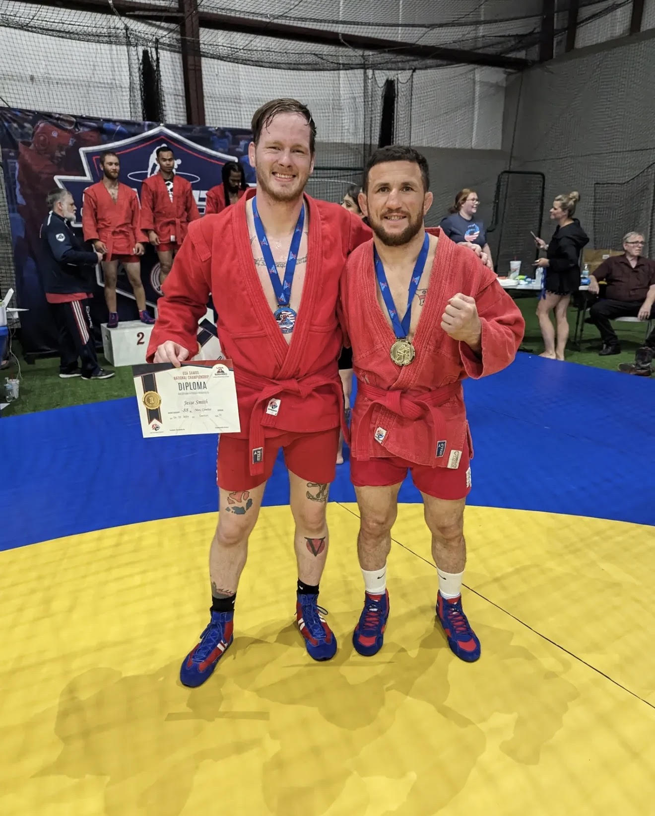 Jackpot MMA athletes on the podium with gold and silver medals at the USA Sambo National Championship