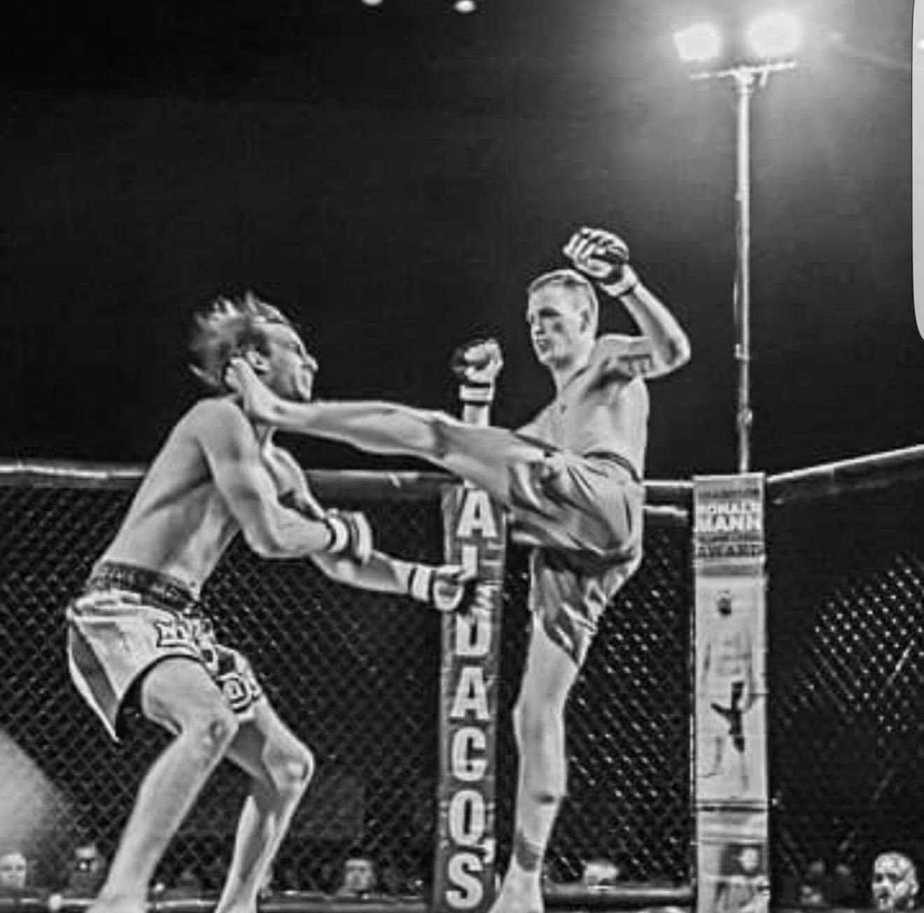 Vintage MMA action shot showing fighter executing a high kick