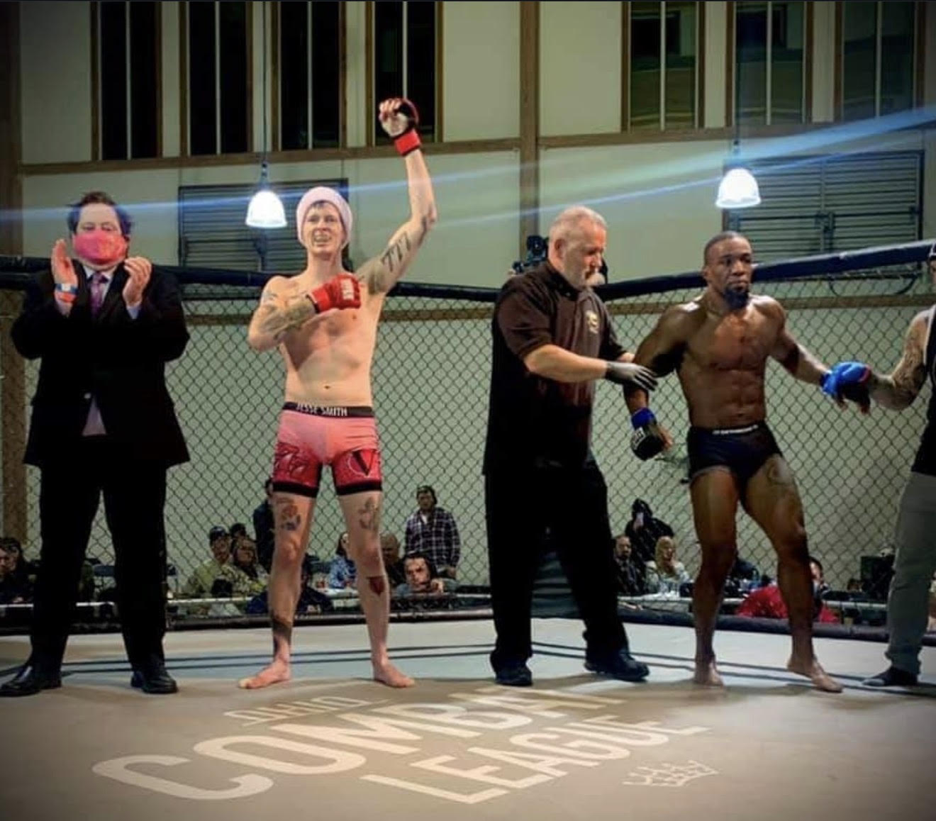 Jesse Smith celebrating with a raised fist after a Combat League victory
